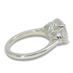 Three Stone Oval Moissanite 4.43ctw. Ring with Half Moon Accents
