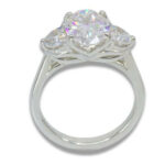 Three Stone Oval Moissanite 4.43ctw. Ring with Half Moon Accents